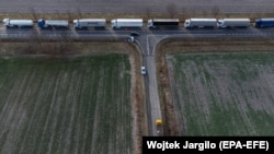 An aerial photo made with a drone shows trucks standing in a queue at the Polish-Ukrainian border in Hrebenne, southeast Poland, on November 27.