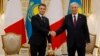 French President Emmanuel Macron (left) shakes hands with his Kazakh counterpart, Qasym-Zhomart Tokaev, in Astana on November 1.