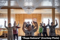 Local women at a dance rehearsal held in their spare time between haymaking and household chores.