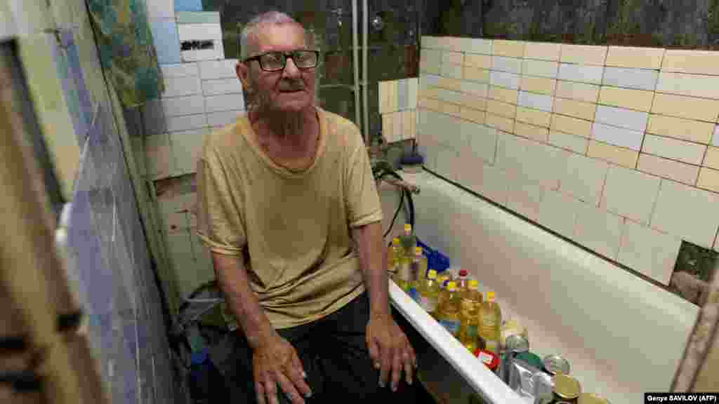 Viktor Grozdov, 77,&nbsp; sits in the bathroom of his damaged home on June 28 in the eastern Ukrainian town of Avdiyivka. The bathroom has become his refuge&nbsp;when the artillery shells rain down. A suburb of the city of Donetsk, Avdiyivka is shelled up to 30 times a day.&nbsp; &quot;In the last four months or so, there hasn&#39;t been a day without aerial or rocket strikes,&quot; the head of the military administration, Vitaliy Barabash, told AFP.