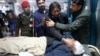 A relative caresses the face of a victim after he succumbed to his injuries following a roadside bombing that targeted a police vehicle near the Afghan border in Bajaur,&nbsp;a tribal district in Pakistan&#39;s Khyber Pakhtunkhwa Province, on January 8.<br />
<br />
The Tehrik-e Taliban Pakistan (TTP) militant group claimed responsibility for the blast, which killed at least seven people. Three police officers remain in critical condition.