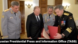 Russian President Vladimir Putin (second left) in a photo from 2018 with Igor Kostyukov (right), head of the GRU military intelligence agency.