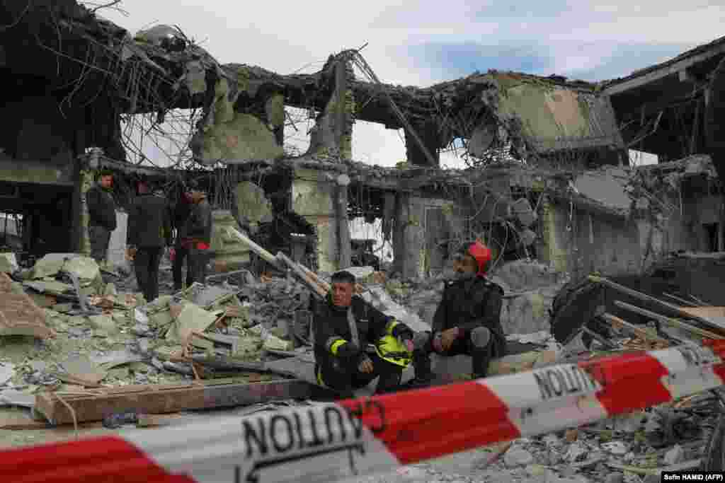 A civil defense team carries out search and rescue operations in a damaged building following a missile strike launched by Iran&#39;s Revolutionary Guard Corps (IRGC) on the Kurdistan region&#39;s capital of Irbil on January 17.