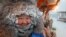 RUSSIA -- Vendor Nyurgusun Starostina, 47, poses for a picture at an open-air market on a frosty day in Yakutsk, Russia, December 5, 2023.