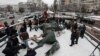 Workers dismantle the monument to Bolshevik military commander Mykola Shchors in Kyiv on December 9.
