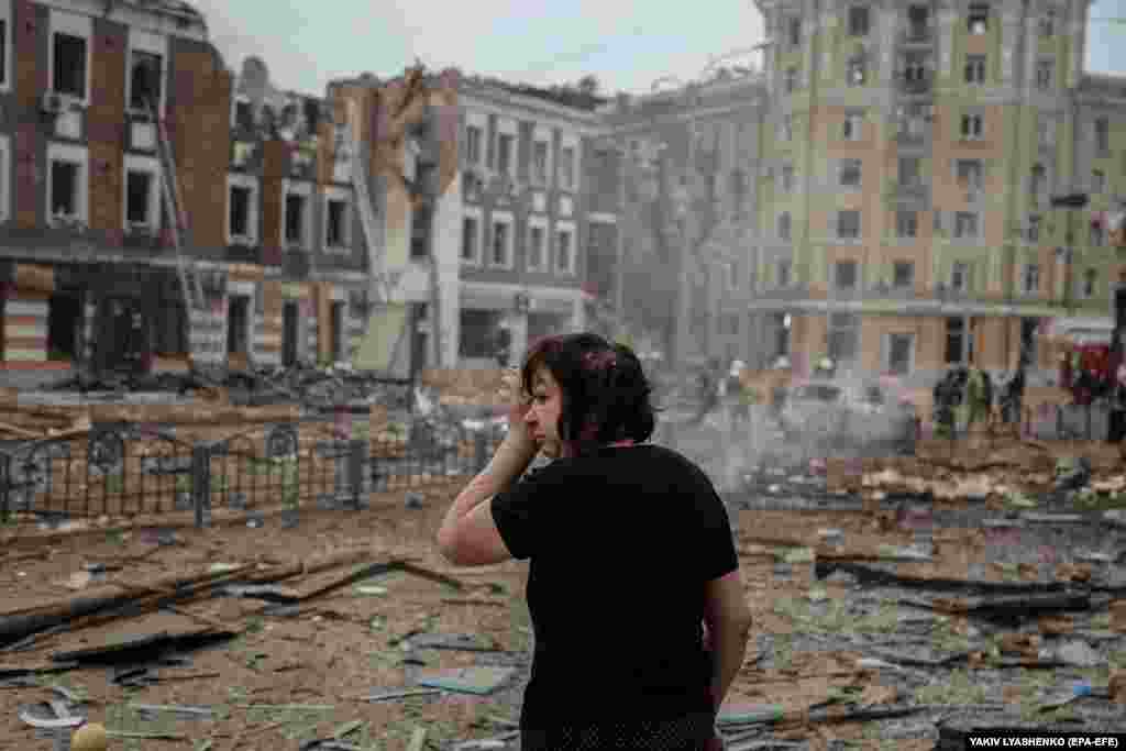 A woman reacts following a missile attack that killed a child in the northeastern city of Kharkiv on October 6. According to Ukrainian officials, early morning missile attacks also targeted grain and port facilities in Odesa, in the country&#39;s south.