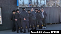 Kyrgyz police break up a protest against changing the national flag in Bishkek on December 3.