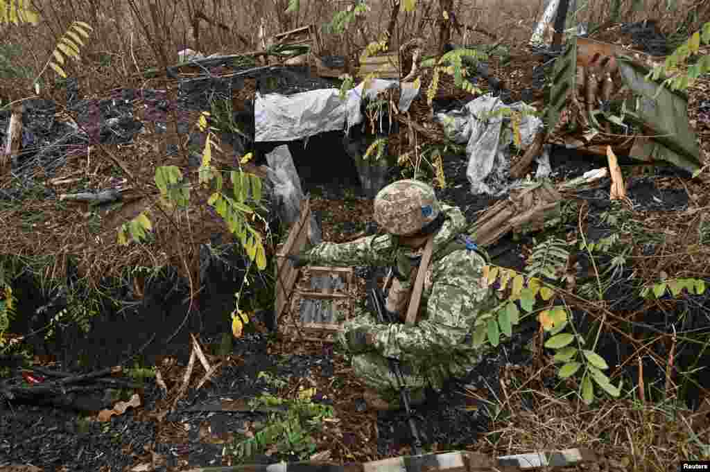 A Ukrainian serviceman inspects ammunition that was left behind by Russian soldiers. Kyiv&#39;s troops were able to liberate Robotyne a few months later.