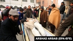 An injured man is shifted to a hospital to receive medical treatment following a blast that targeted a police vehicle near the Afghan border in the Bajaur district of Khyber Pakhtunkhwa on January 8.