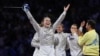 Olha Kharlan celebrates as Ukraine wins the women's team saber fencing event at the Paris Olympics on August 3. 