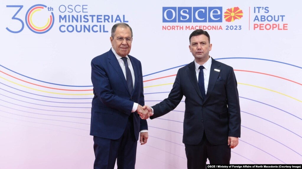 Macedonian Foreign Minister Bujar Osmani (right) welcomes his Russian counterpart, Sergei Lavrov, to the OSCE summit in Skopje on November 30.