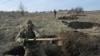 UKRAINE -- Ukrainian servicemen of the 42nd Mechanised Brigade dig trenches during a field military exercise in the Donetsk region on December 6, 2023
