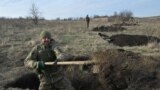 UKRAINE -- Ukrainian servicemen of the 42nd Mechanised Brigade dig trenches during a field military exercise in the Donetsk region on December 6, 2023
