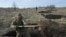 UKRAINE -- Ukrainian servicemen of the 42nd Mechanised Brigade dig trenches during a field military exercise in the Donetsk region on December 6, 2023