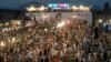 Supporters of former Prime Minister Imran Khan and his Pakistan Tehrik-e Insaf party rally on August 5 to mark the first anniversary of Khan's imprisonment. 