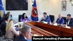 Kosovar President Vjosa Osmani leads a meeting on finding a date for parliamentary elections on July 30.