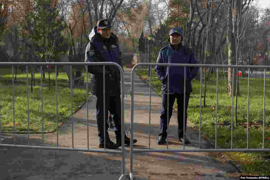 Police officers stand behind a fence at the rally. An RFE/RL correspondent noted the heavy police presence both in uniform and in civilian clothes at the event. Kazakhstan&#39;s Feminita Feminist Initiative voiced its skepticism of the rally on its Instagram page:&nbsp;&quot;Aggressive communication, visuals, and rapid gathering of young people looks like another state project organized by officials,&quot; they wrote.