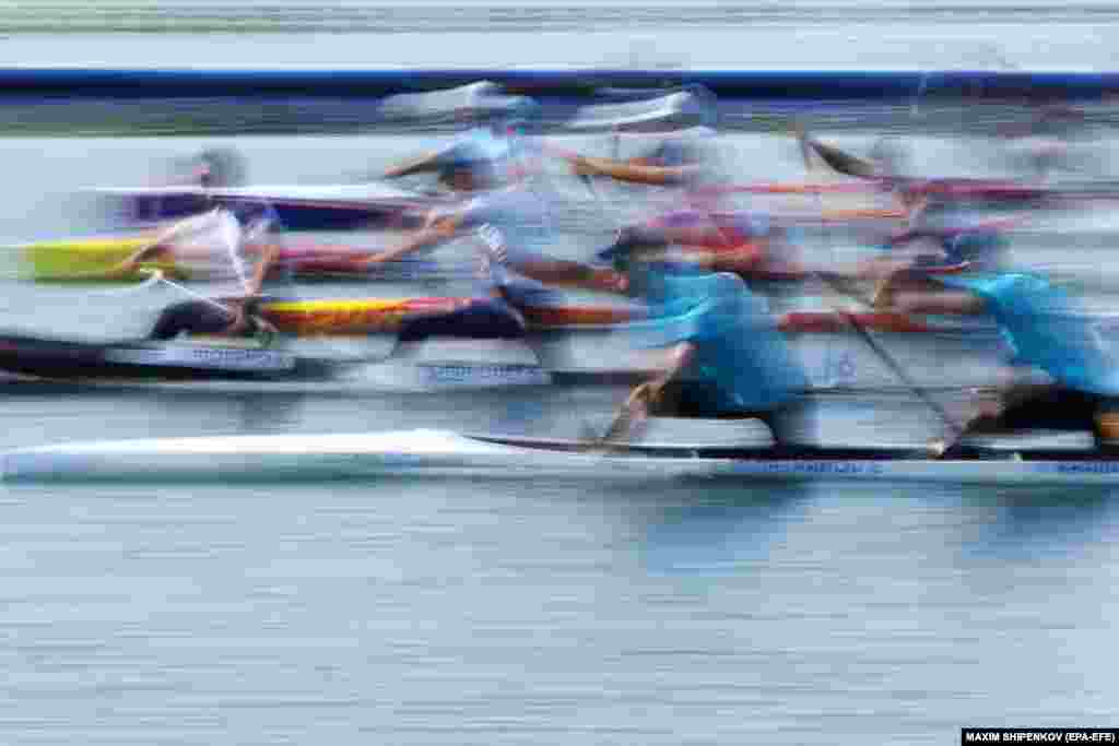 An image taken with a slow shutter speed shows Sergei Yemelyanov (front left) and Timur Khaidarov (front right) of Kazakhstan competing during the men&#39;s canoe double 500m heats of the canoeing sprint competitions at the Paris 2024 Olympics at the Vaires-sur-Marne Nautical Stadium in Vaires-sur-Marne, France.