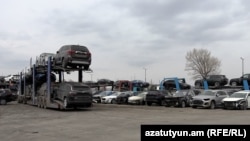 Armenia - Car carrier trailers line up near a customs terminal outside Gyumri, March 13, 2023