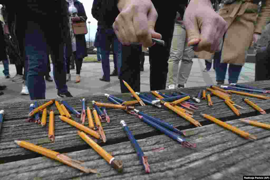 A member of the Union of Journalists breaks pencils during a protest outside the parliament during a session about controversial amendments to the criminal code that would make defamation a crime punishable with stiff fines, in the Bosnian town of Banja Luka on March 14.