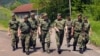General Milan Mojsilovic (in green boots) visits Serbian Army units that were ordered to combat readiness over the situation in Kosovo in May.