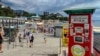 Tourists enjoy the sights along the beach at Alushta, located on the Crimean Peninsula&#39;s southern coastline. The peninsula, which is internationally recognized as Ukrainian territory, has been occupied by Russia since its illegal annexation and takeover in 2014.<br />
&nbsp;