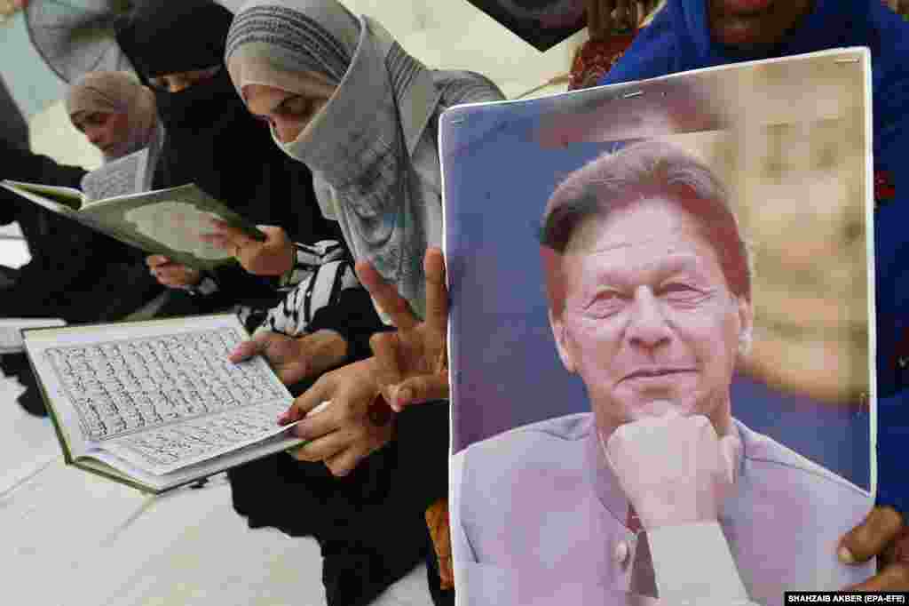 Supporters of the Pakistan Tehrik-e Insaf (PTI) party read the Koran to mark a prison anniversary of former Prime Minister and PTI Chairman Imran Khan, in Karachi. August 5 marked one year since Khan was imprisoned on corruption charges.