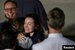 Alsu Kurmasheva is greeted by family at Joint Base Andrews in Maryland, US, August 2, 2024