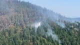 Ponijeri, Kakanj, Bosnia-Herzegovina, Extinguishing a wildfire from a helicopter on the Ponijeri mountain in central Bosnia. August 16, 2024. 