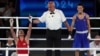 Abdumalik Halokov (left) of Uzbekistan celebrates winning the gold medal against Kyrgyzstan's Munarbek Seiitbek-uulu in Paris.