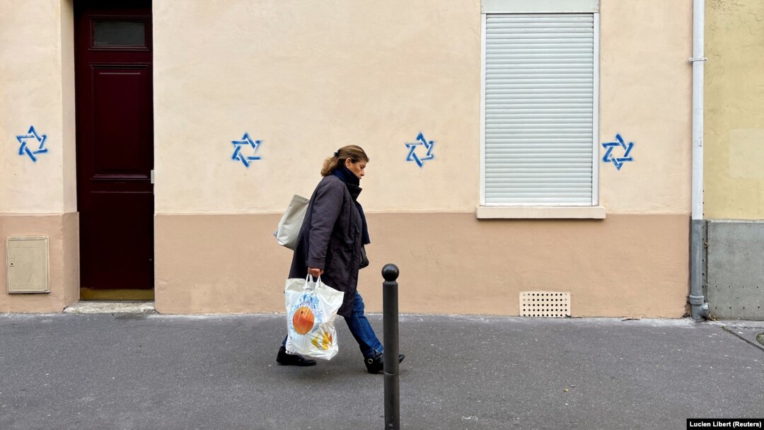 Dozens of Stars of David resembling those on the flag of Israel were painted on buildings in Paris and several suburbs on October 31, triggering alarm about surging anti-Semitism in France.