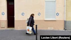 Dozens of Stars of David resembling those on the flag of Israel were painted on buildings in Paris and several suburbs on October 31, triggering alarm about surging anti-Semitism in France.