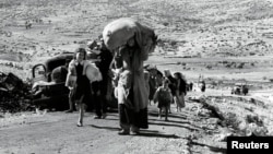 არაბები ტოვებენ სოფლებს გალილეის ტერიტორიიდან. 1948 წლის ოქტომბერი.