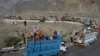 Trucks transporting Afghan refugees with their belongings are seen along a road toward the Pakistan-Afghanistan Torkham border, following Pakistan's government decision to expel people illegally staying in the country.