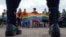 Police officers watch as people wave rainbow flags during a gay pride rally in St. Petersburg in 2017.