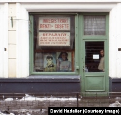 A shop in Iasi advertises audiotape recordings and watch repairs.