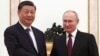 Russian President Vladimir Putin (right) shakes hands with Chinese President Xi Jinping during a meeting at the Kremlin in Moscow on March 20.