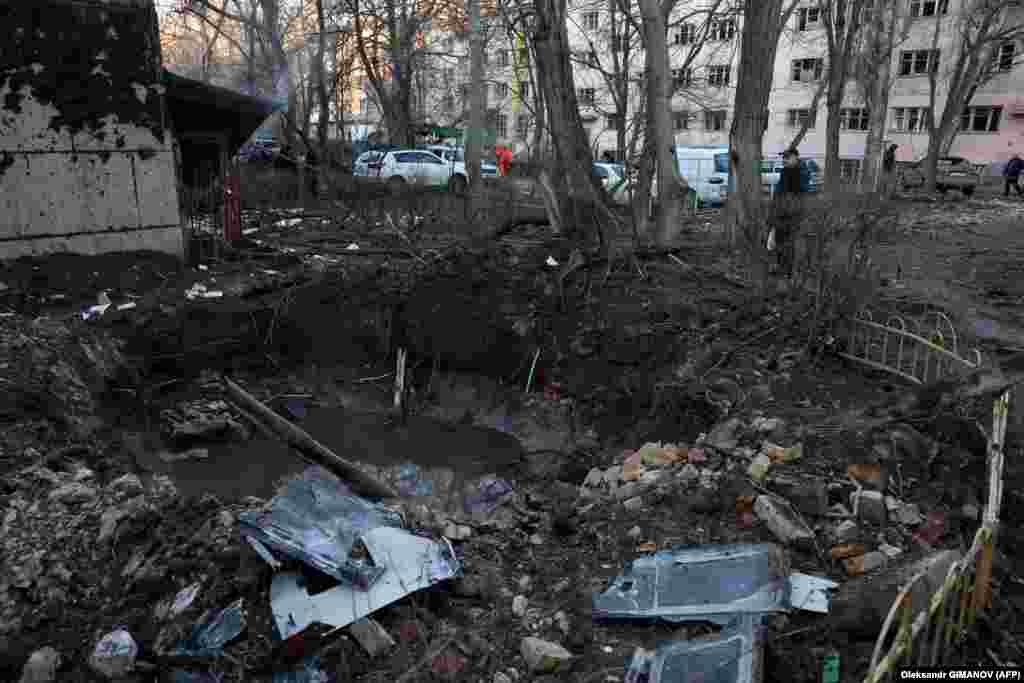 A large crater now stands in the courtyard of a residential building in Odesa. Moscow has repeatedly tried to hit infrastructure in Ukraine&#39;s southern Black Sea ports since it pulled out of a UN-brokered deal that allowed safe passage of Ukrainian grain shipments via the sea.