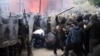 Soldiers of NATO-led international peacekeeping Kosovo Force (KFOR) scuffle with ethnic Serbs in front of the building of the municipality in Zvecan, Kosovo, on May 29, 2023. 