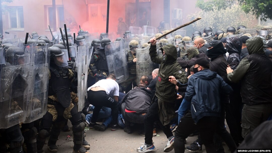 Soldiers of NATO-led international peacekeeping Kosovo Force (KFOR) scuffle with ethnic Serbs in front of the building of the municipality in Zvecan, Kosovo, on May 29, 2023. 