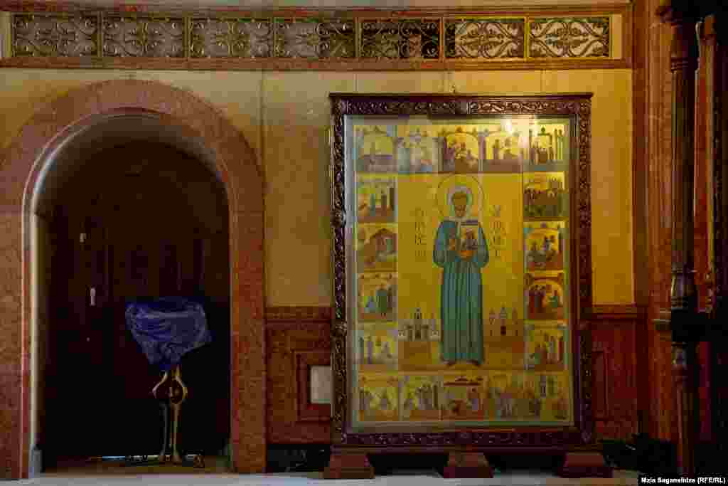 An Icon of St. Matrona of Moscow inside Tbilisi&#39;s Holy Trinity Cathedral that features a panel at lower left depicting notorious Soviet dictator Josef Stalin. News of the donated artwork caused a furor in Georgia and the icon was defaced soon after this January 8 photo was taken. The icon panel is one of many depictions of Stalin seen today across Georgia, the country of his birth.&nbsp;