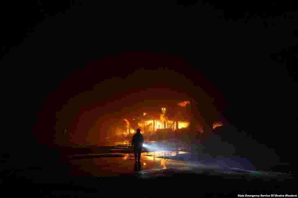 A firefighter works at the site where storage facilities were heavily damaged by a Russian missile strike in the Odesa region on May 8.