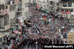 Митинг солидарности с палестинцами сектора Газа в столице Иордании Аммане. 27 октября 2023 года