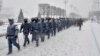 Russian National Guard soldiers walk in Moscow on December 4. 