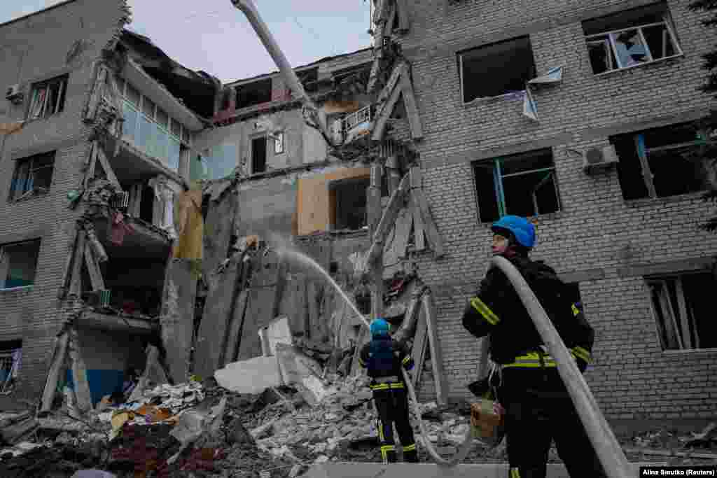 Ukrainian rescuers work at a hospital that was badly damaged by a Russian missile strike in the town of Selydove in the Donetsk region.