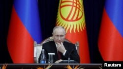 KYRGYZSTAN - Russia's President Vladimir Putin attends a signing ceremony following Russian-Kyrgyz talks in Bishkek, October 12, 2023.