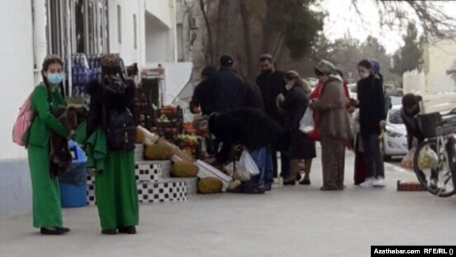 Turkmen line up outside a grocery story to buy food in the capital, Ashgabat, amid an ongoing economic crisis.