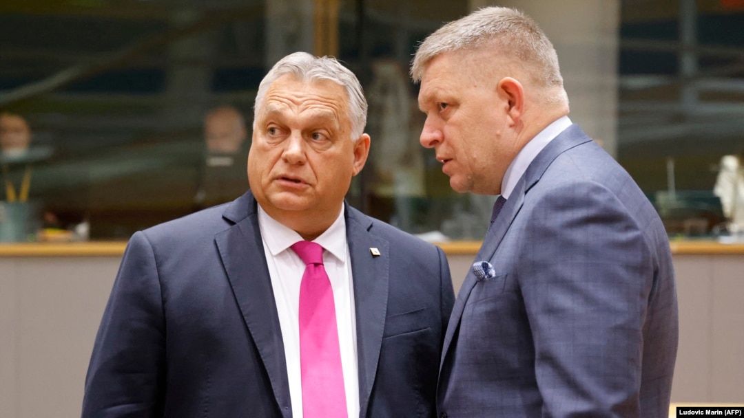 Hungarian Prime Minister Viktor Orban (left) speaks with his Slovakian counterpart Robert Fico prior to the start of a EU leaders summit in Brussels. (file photo)