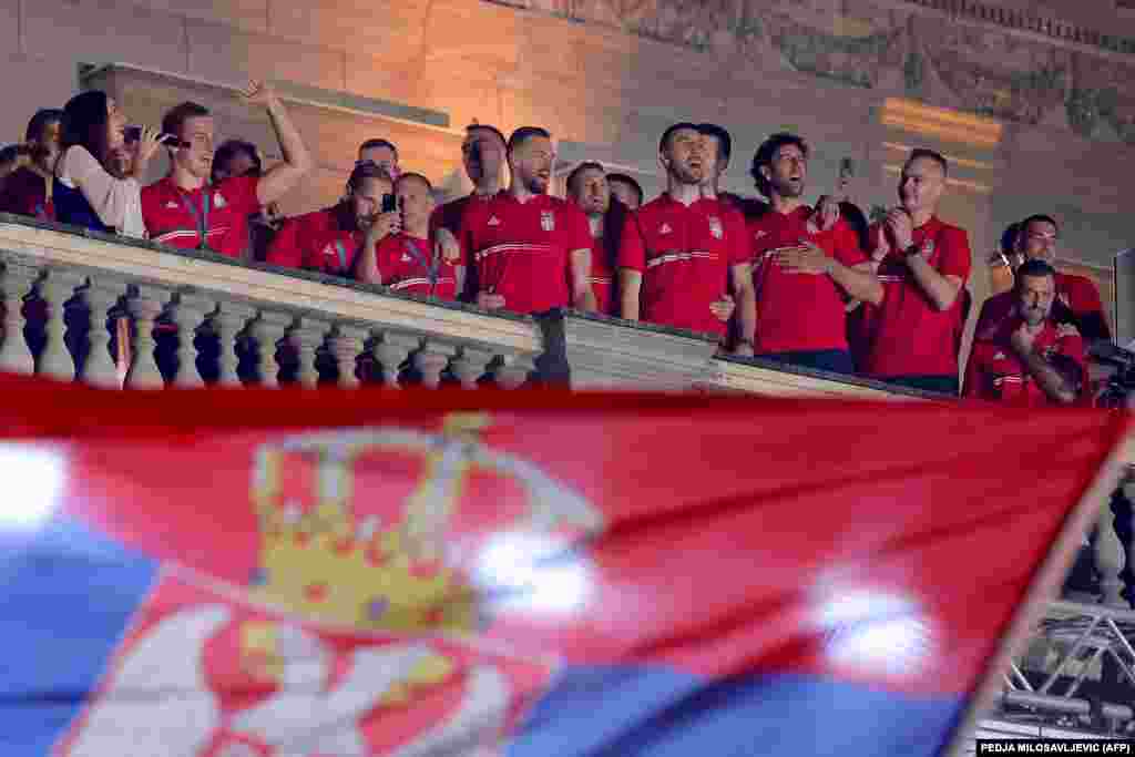 Serbian Olympic athletes celebrate during a welcoming ceremony at the Belgrade City Hall.