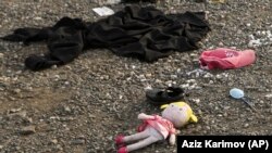 Nagorno-Karabakh - A doll and children's personal belongings lie on the ground in Stepanakert, October 2, 2023. 